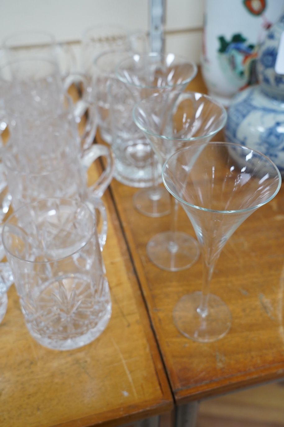 A collection of crystal glassware to include a set of ten tankards, wine glasses and tumblers, tallest 19cm. Condition - varies, mostly fair